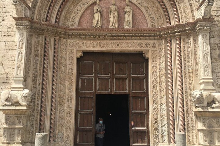 An ornate entrance with intricate carvings and statues. 2