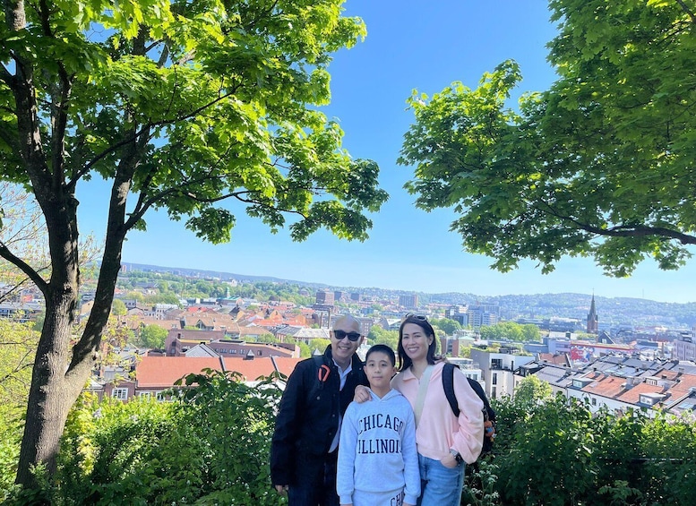 A family posing with a cityscape in the background. 3