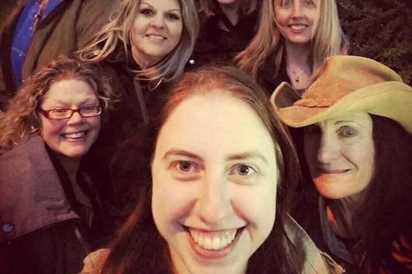 A group of people in close proximity, some wearing hats. 2