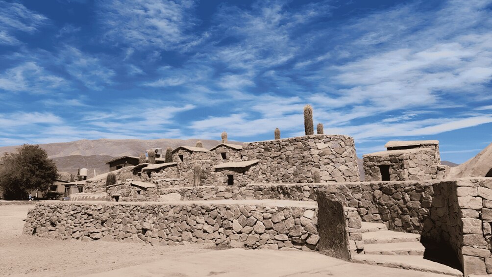 Ancient stone ruins with a clear sky. 5