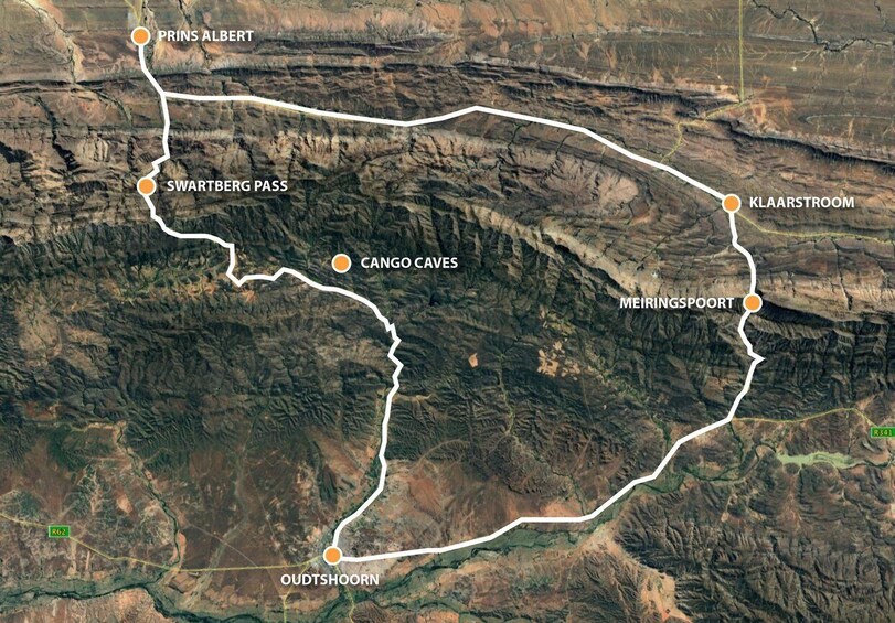 A satellite view of a mountainous region with marked locations including Prins Albert, Swartberg Pass, Cango Caves, Oudtshoorn, Klaspoort, and Meiringspoort. 4