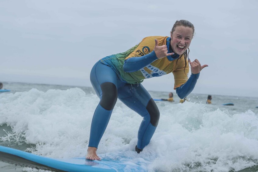 A person surfing on a wave. 1