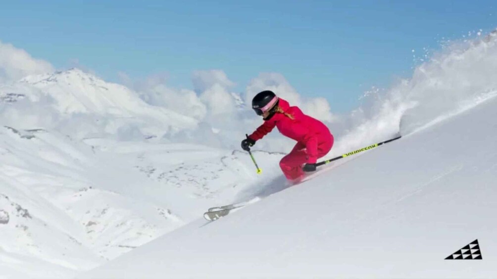 A person skiing down a snowy slope. 2
