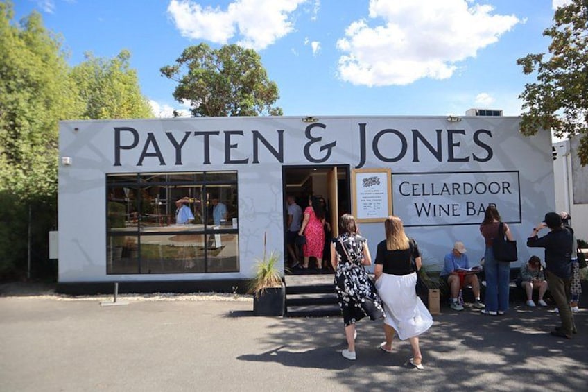 A white mobile wine bar named Payten & Jones with a sign indicating it's a cellar door wine bar. 2