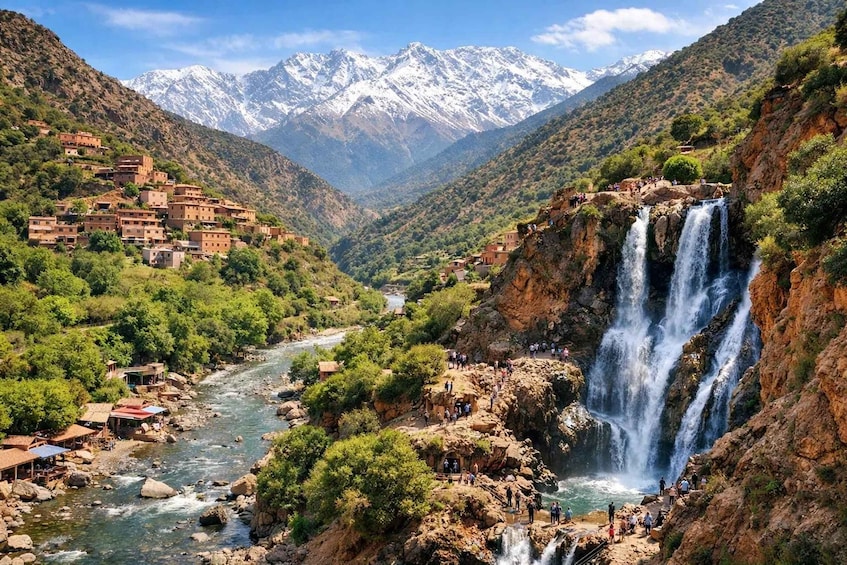 A mountainous landscape with a river, a waterfall, and a village with traditional buildings. 3