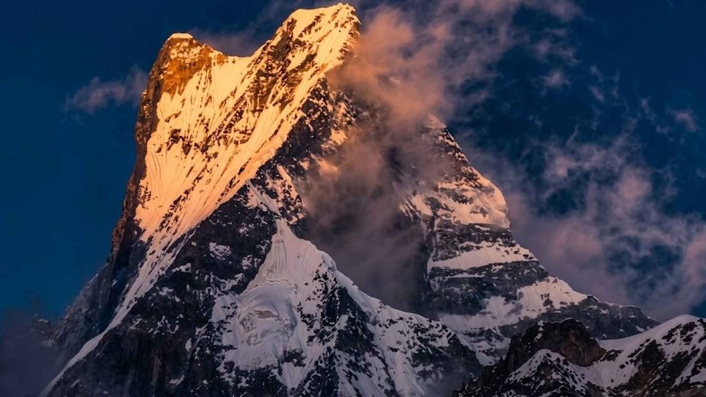 A snow-covered mountain peak with a sharp peak and a rugged terrain. 3