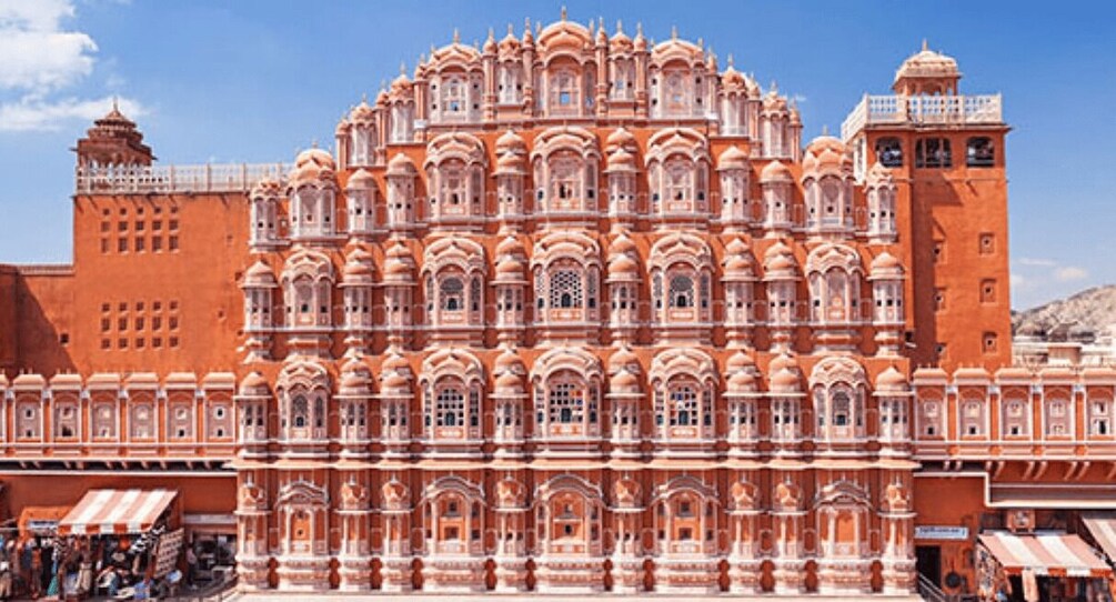 A large, ornate building with multiple levels and intricate architectural details. 4