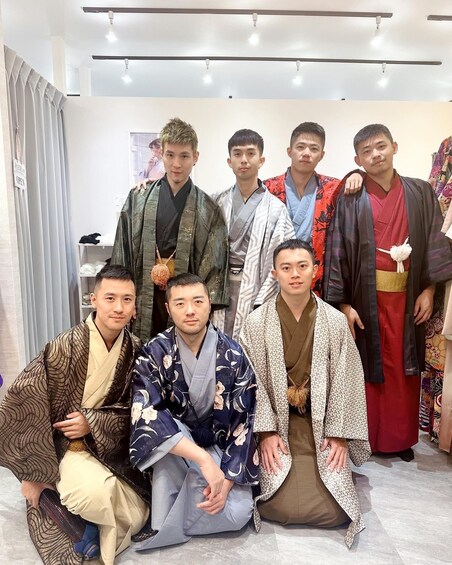 A group of people in traditional Japanese attire posing indoors. 3