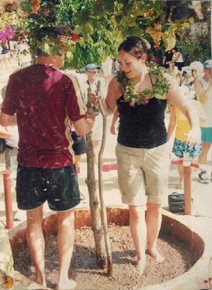 A man and a woman planting a tree in a garden. 3