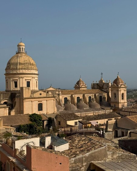 A historic church with a large dome and multiple smaller domes, surrounded by traditional buildings. 2