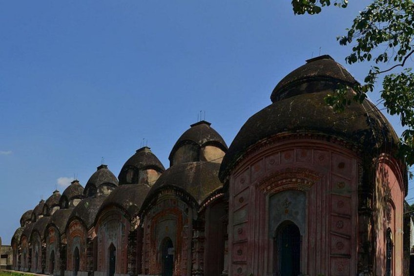 A row of domed structures with arched doorways, likely part of a historical or religious building. 3