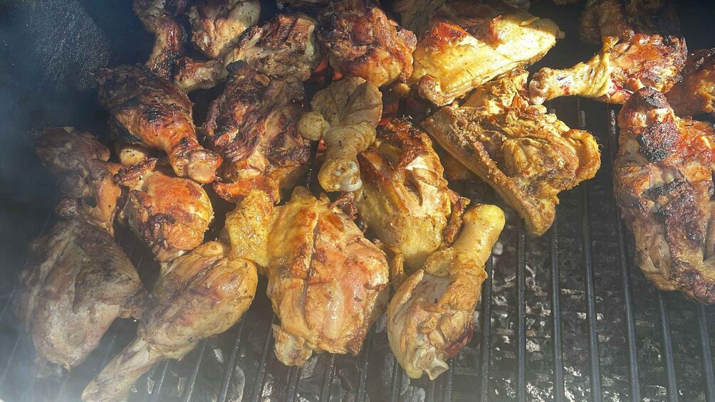 Grilled chicken wings on a grill. 5