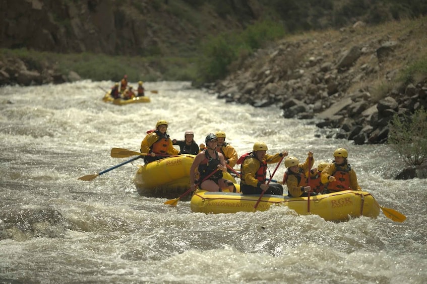 A group of people rafting on a river. 4
