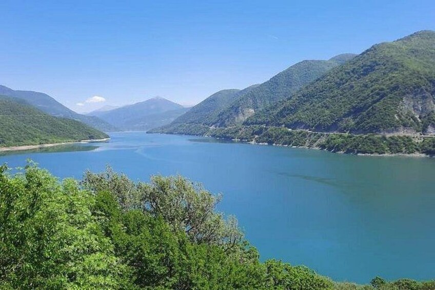 A lake surrounded by mountains. 2