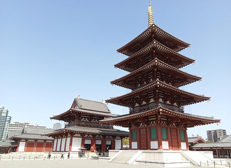 A traditional Japanese pagoda with multiple tiers and a golden spire. 1