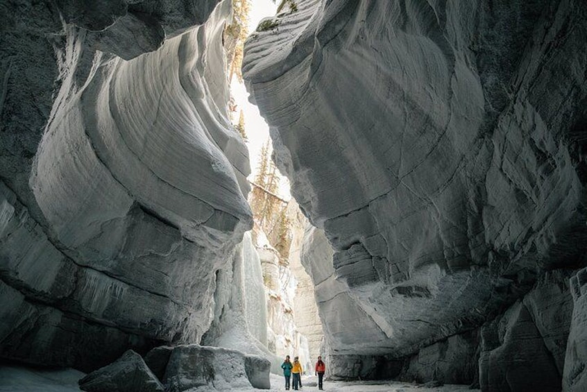 A large rock formation with a narrow passageway. 5