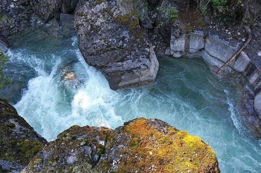A fast-flowing river between rocky cliffs. 4