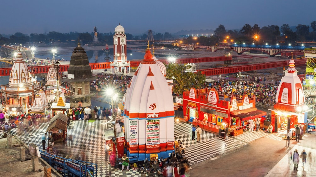 A temple complex with domed structures and a checkered ground. 4