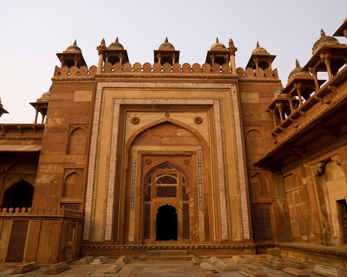 A historic building with intricate arches and domes. 3
