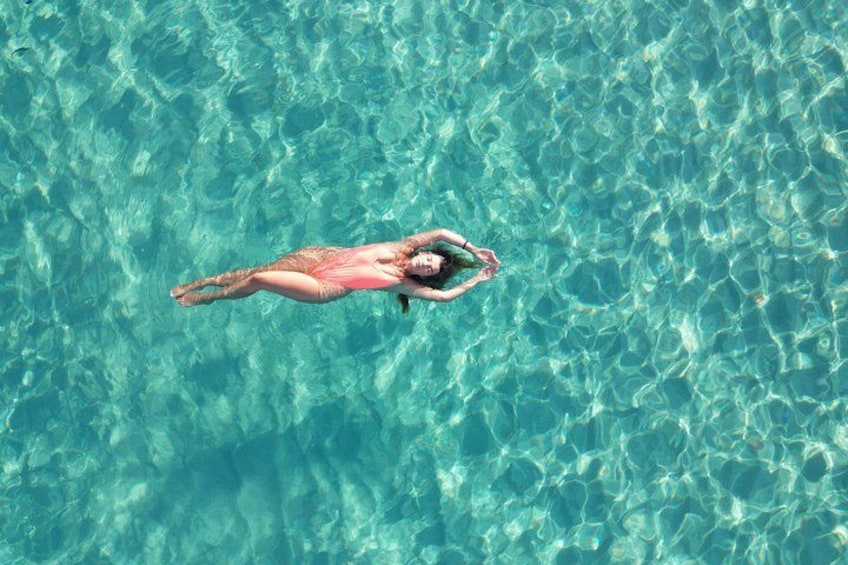 A person floating on water. 5