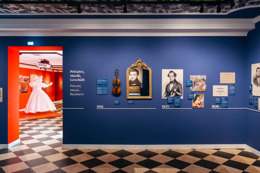 An art exhibition with historical artifacts and information panels. 2