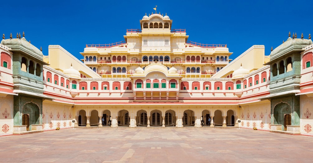 A grand palace with multiple arches and a central tower. 2