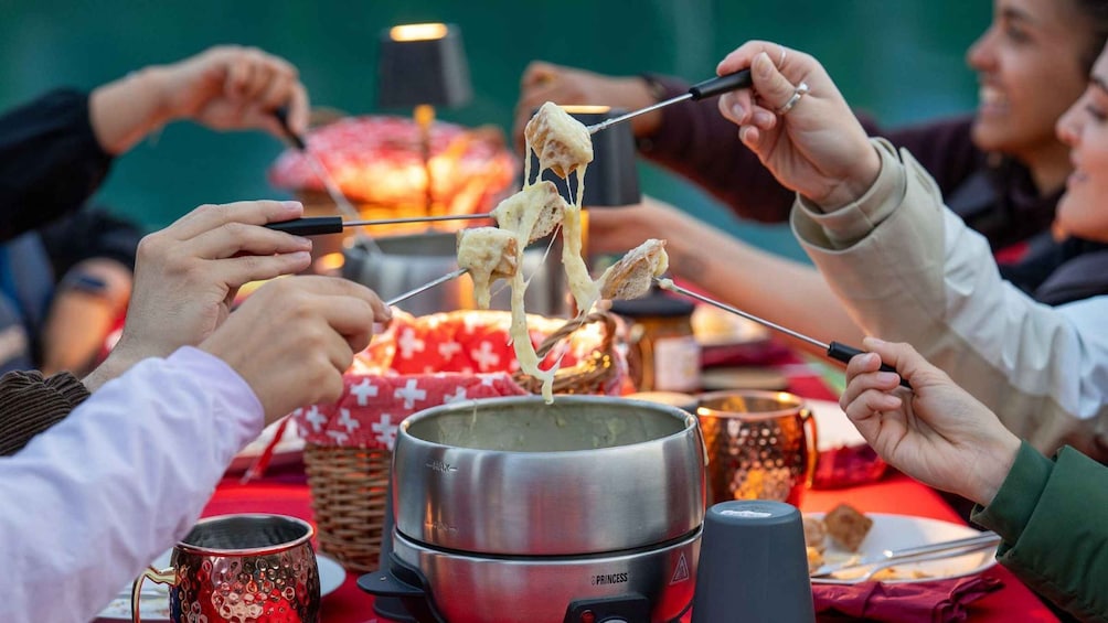 Picture 5 for Activity Interlaken: Cheese Fondue Float 5