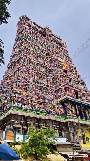 A multi-tiered temple with intricate carvings and statues. 4