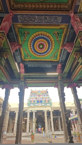 A temple with intricate carvings and a colorful ceiling. 3