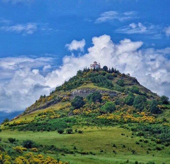 A church on a hilltop with a clear sky. 4