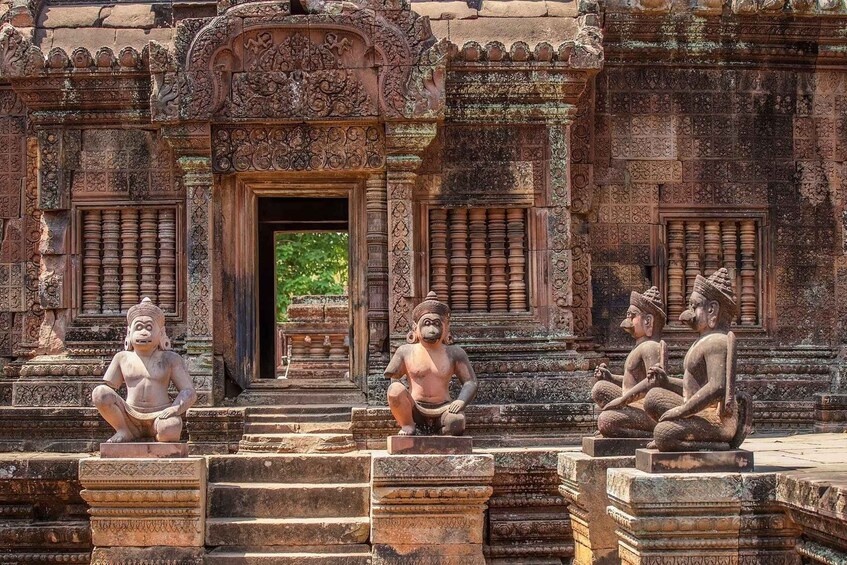 A temple entrance with intricate carvings and statues of figures. 4
