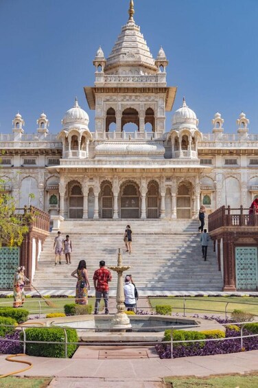 A grand, ornate building with multiple domes and a large staircase leading to the entrance. 2