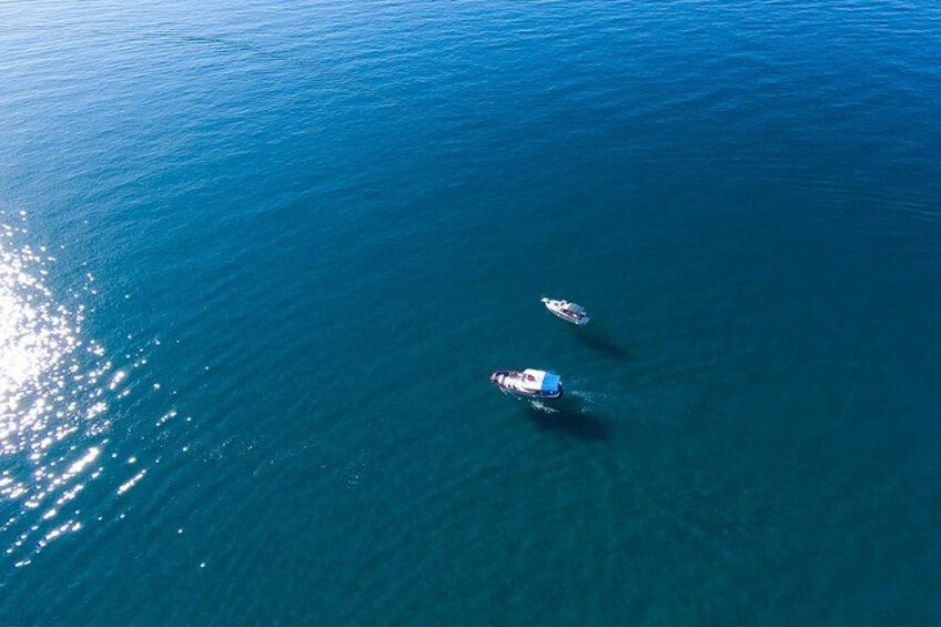 Two boats on a calm blue sea. 5