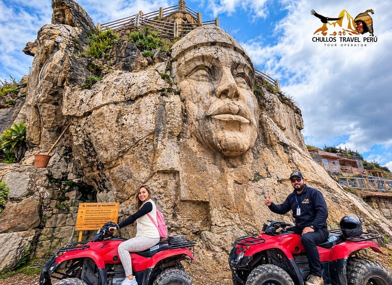 A large rock face with a carved face, a sign reading 'El Chullpas de Raccahapata,' and two people on red ATVs. 1