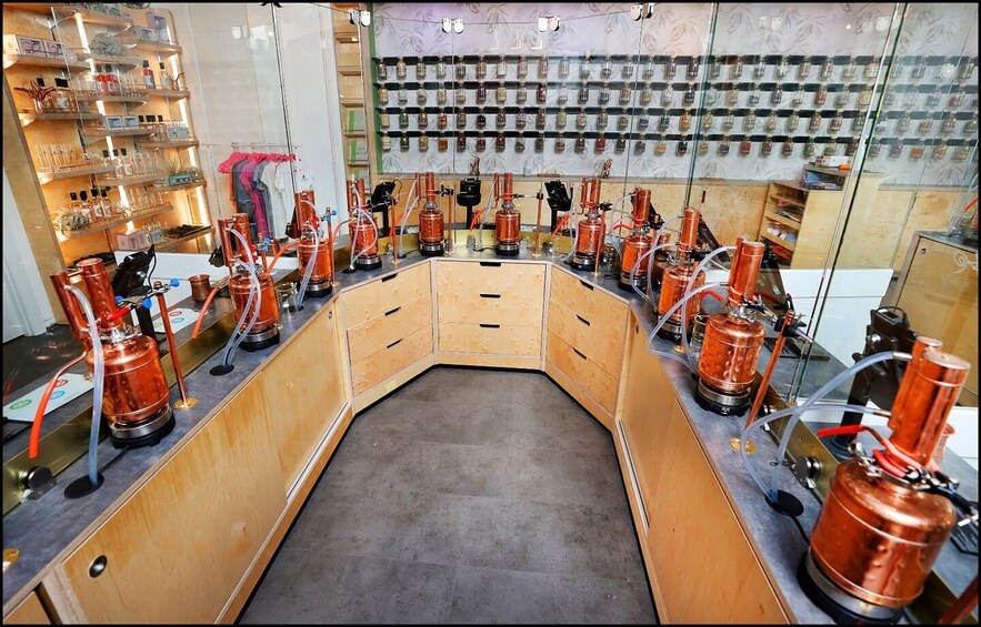 A laboratory with copper distillation apparatus arranged in a U-shape. 1