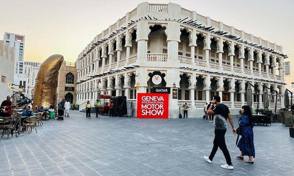 A historic building with a sign for the Geneva International Motor Show. 3