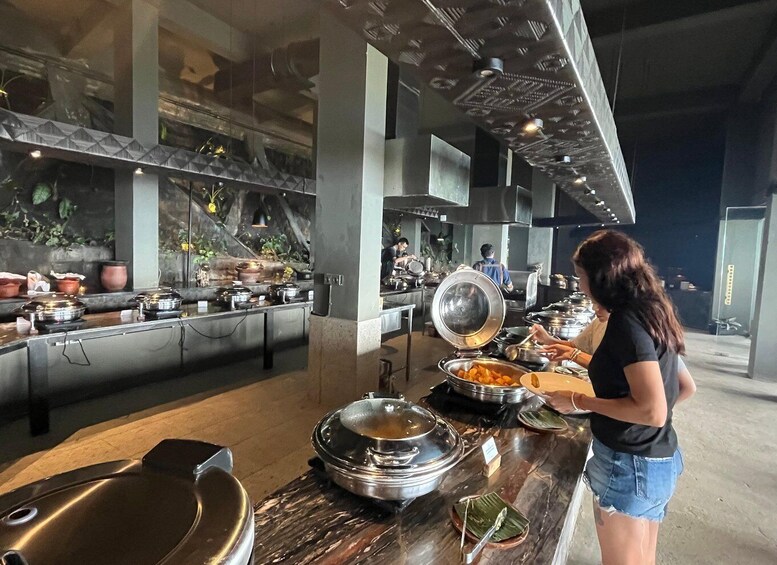 A buffet setup with various food items and cooking stations. 5