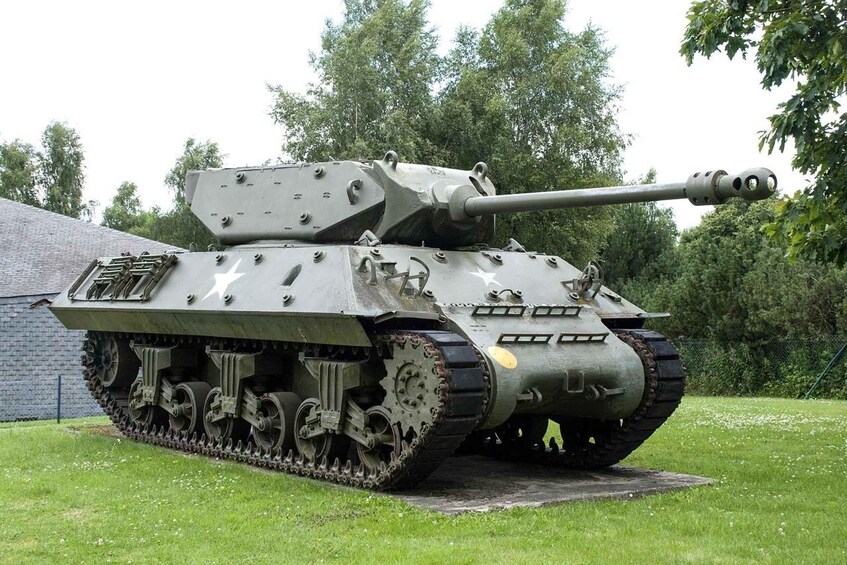 A military tank with tracks, a long barrel, and a turret with a large gun. 3