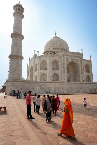 The Taj Mahal with visitors around it. 2
