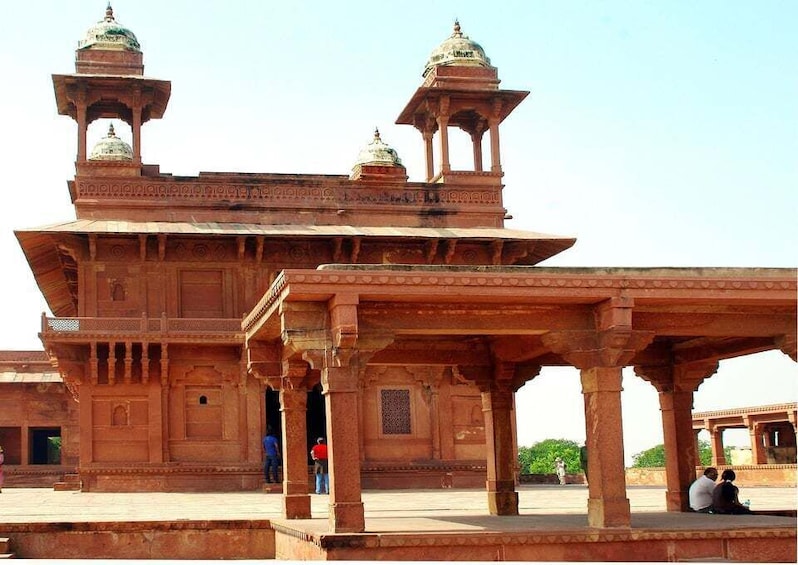 A large, ornate building with multiple domes and a central pavilion. 5