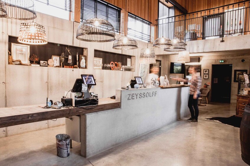 A modern interior with a reception desk labeled 'ZEYSSOLFF'. 3