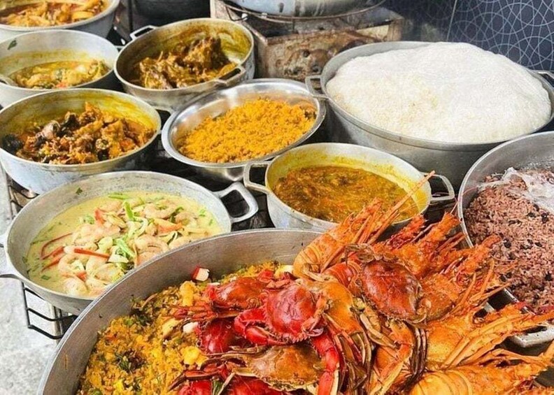 A variety of seafood dishes, including crab, rice, and curries. 4