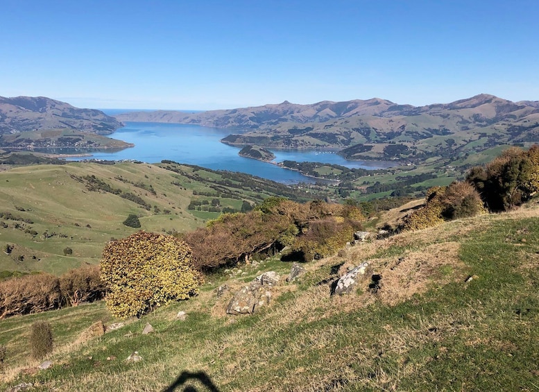 A valley with a lake surrounded by hills. 5