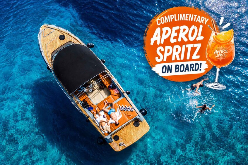 A boat on clear blue water with people swimming nearby and a drink labeled 'Aperol Spritz' on the deck. 1