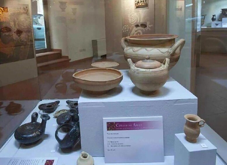 A museum display of ancient pottery. 2