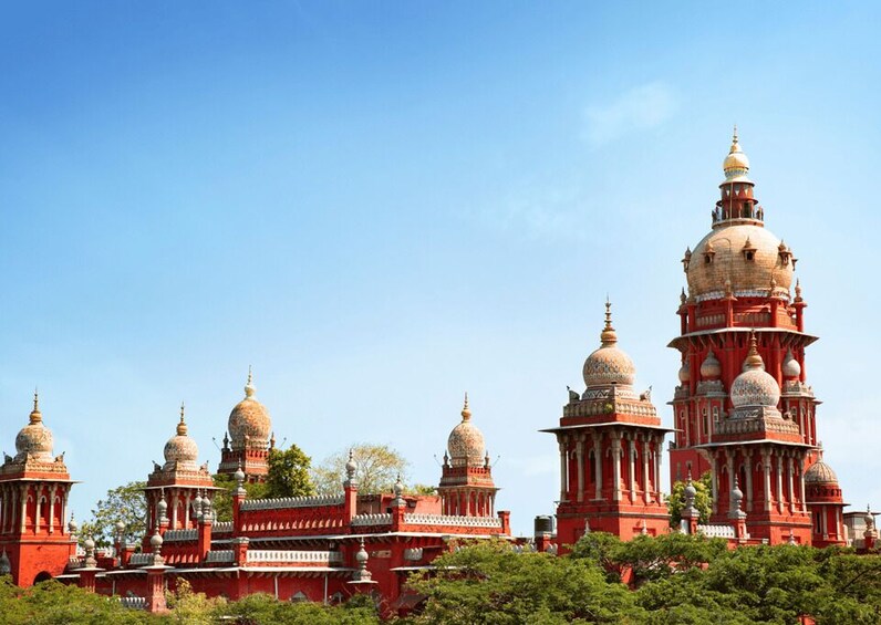 A large red building with multiple domes and towers. 2