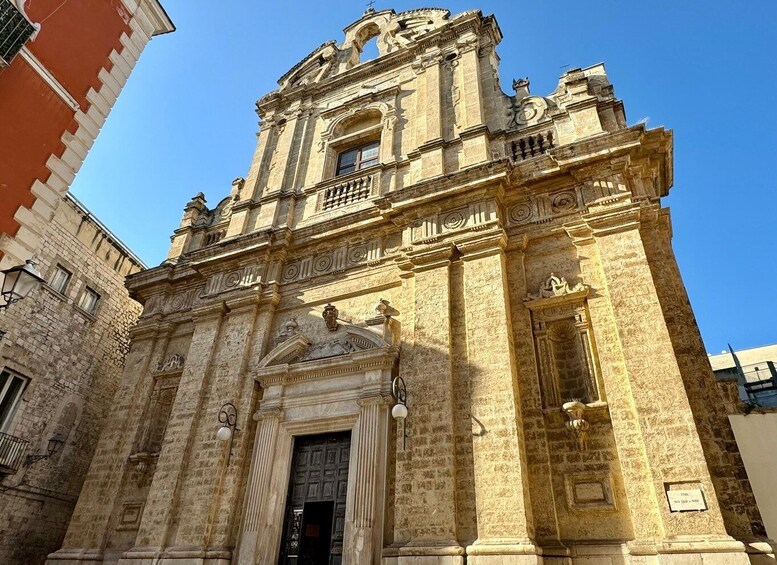 A historic church with ornate architecture, including a prominent bell tower and detailed facade. 5
