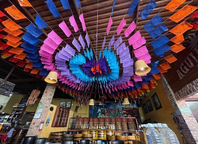 A colorful, intricate ceiling decoration in a restaurant. 5