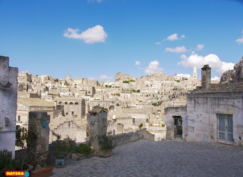 A historic town with stone buildings and a cobblestone street. 5