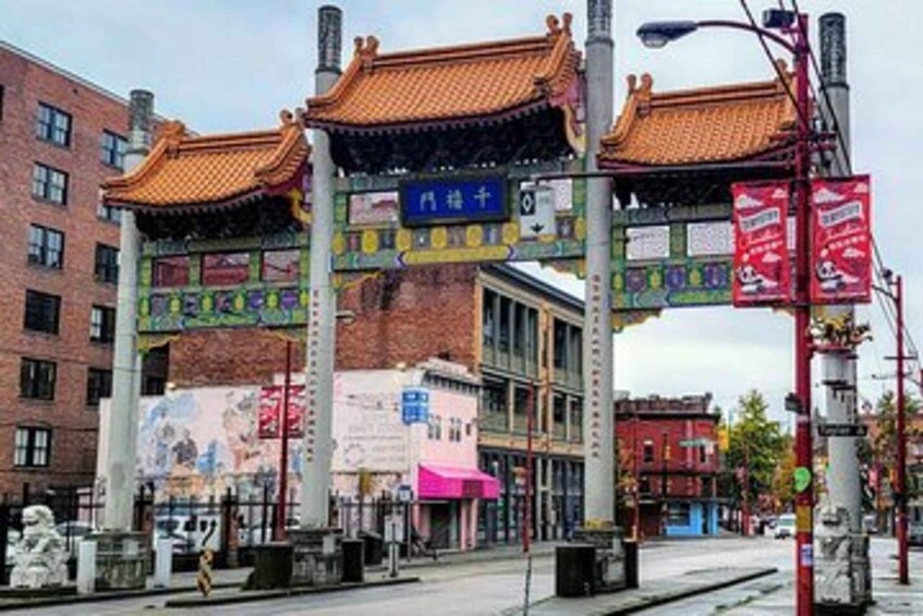 A street with traditional Chinese architecture, including a pagoda-style structure and a sign with Chinese characters. 3